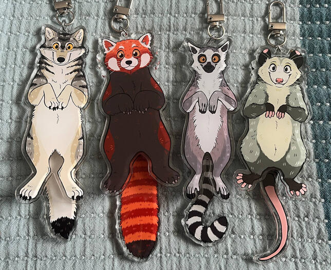 Wolf, red panda, lemur and opossum charms.